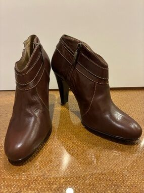 Bruno Magli Campione leather ankle bootie with brass accents, inside zip. Sz37